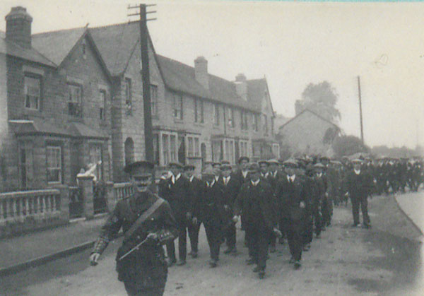 Captain Harold Welch marching with recruits
